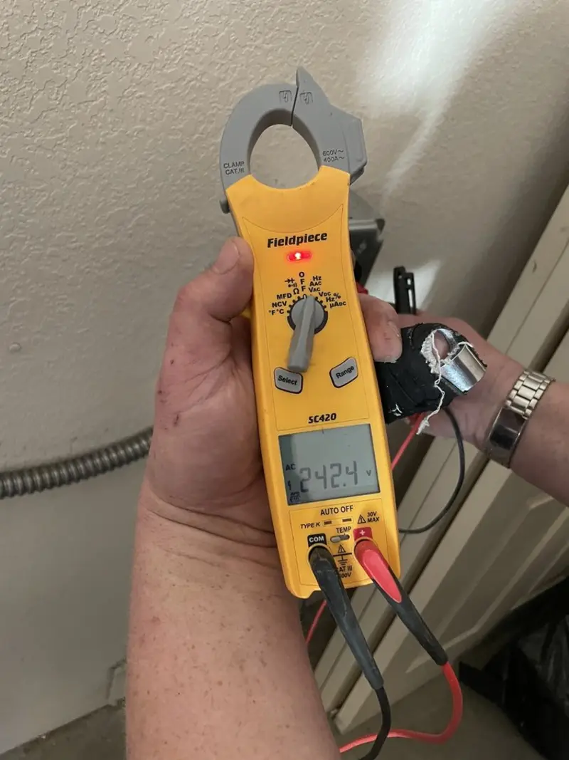 Voltage testing with clamp meter during Circuit Breaker Repair in Wolf